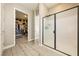 Modern bathroom with a glass-enclosed shower, sleek fixtures, and a doorway to walk-in closet at 4772 Se Argent Hills Ave, Pahrump, NV 89061