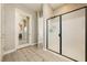 Modern bathroom with a glass-enclosed shower, sleek fixtures, and stylish tile flooring at 4772 Se Argent Hills Ave, Pahrump, NV 89061