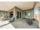 Relaxing covered patio with stone pavers and comfortable seating at 4772 Se Argent Hills Ave, Pahrump, NV 89061