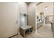Welcoming entryway with convenient bench seating and access to kitchen at 4772 Se Argent Hills Ave, Pahrump, NV 89061