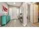 Inviting entryway boasts natural light, modern décor, and wood-look flooring for added appeal at 4772 Se Argent Hills Ave, Pahrump, NV 89061