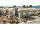 Aerial view of a modern single-story home with desert landscaping and a two-car garage at 4772 Se Argent Hills Ave, Pahrump, NV 89061