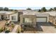 Stunning single-story home featuring desert landscaping and a stylish gray exterior at 4772 Se Argent Hills Ave, Pahrump, NV 89061