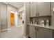 Hallway with built in cabinets and a view to a full bathroom at 4772 Se Argent Hills Ave, Pahrump, NV 89061