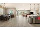 Spacious open-concept living space featuring a kitchen, dining area, and living room with backyard access at 4772 Se Argent Hills Ave, Pahrump, NV 89061