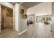 Open living space with modern wood-look flooring, leading to the bathroom, dining and living areas at 4772 Se Argent Hills Ave, Pahrump, NV 89061