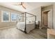Brightly-lit main bedroom featuring wood-look tile flooring, a ceiling fan and natural light at 4772 Se Argent Hills Ave, Pahrump, NV 89061