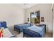 Neutral room featuring twin beds with soft carpet and natural light at 482 Bonnie Brook Pl, Henderson, NV 89012