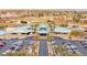A clubhouse boasts desert landscaping with ample parking in a desert golf community at 482 Bonnie Brook Pl, Henderson, NV 89012