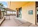 Exterior shot of 'The Willows' entrance, featuring covered patio and a tranquil setting at 482 Bonnie Brook Pl, Henderson, NV 89012
