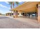 Covered entryway and entrance to the community clubhouse featuring stone accents and ample parking at 482 Bonnie Brook Pl, Henderson, NV 89012