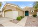 Well-maintained home featuring desert landscaping, tile roof, and attached two car garage at 482 Bonnie Brook Pl, Henderson, NV 89012