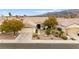 Beautiful home with desert landscaping, tile roof, and attached two car garage at 482 Bonnie Brook Pl, Henderson, NV 89012