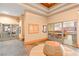 Hallway leading to multiple creative rooms and workshop spaces with comfortable seating at 482 Bonnie Brook Pl, Henderson, NV 89012
