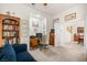 Inviting home office with a cozy blue sofa, built-in bookcase, and a well-lit workspace at 482 Bonnie Brook Pl, Henderson, NV 89012