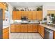 Well-equipped kitchen with stainless steel appliances and ample wooden cabinetry at 482 Bonnie Brook Pl, Henderson, NV 89012