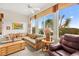 Comfortable living area featuring a ceiling fan and bright views from large windows at 482 Bonnie Brook Pl, Henderson, NV 89012