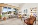 Inviting living room featuring large windows, plush seating, and a neutral color palette at 482 Bonnie Brook Pl, Henderson, NV 89012