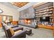 Cozy living room area with a brick fireplace, bookshelves, comfortable seating and a television at 482 Bonnie Brook Pl, Henderson, NV 89012