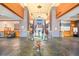 Elegant clubhouse lobby with high ceilings, stone pillars, and a decorative glass table centerpiece at 482 Bonnie Brook Pl, Henderson, NV 89012