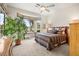 Bright bedroom with bay window offering outdoor views and a queen bed with blue bedding at 482 Bonnie Brook Pl, Henderson, NV 89012