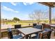 Inviting outdoor patio with stylish seating and views of the fountain and lush green landscape at 482 Bonnie Brook Pl, Henderson, NV 89012