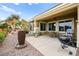 Charming patio with an outdoor grill, dining set, and decorative fountain, perfect for entertaining outdoors at 482 Bonnie Brook Pl, Henderson, NV 89012