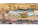 An aerial view of the community recreation area with bocce ball, tennis courts, pool and parking at 482 Bonnie Brook Pl, Henderson, NV 89012