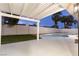 Backyard features a pool, lush lawn, and covered patio; ideal for enjoying the outdoors and relaxing in style at 4842 Plata Del Sol Dr, Las Vegas, NV 89121