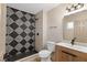 Modern bathroom features decorative tile shower, wood vanity, and contemporary fixtures at 4842 Plata Del Sol Dr, Las Vegas, NV 89121