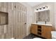 Stylish bathroom featuring a modern vanity, eye-catching tile work, and sleek fixtures at 4842 Plata Del Sol Dr, Las Vegas, NV 89121