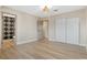 Bright bedroom with neutral walls, wood floors, and ensuite bath access at 4842 Plata Del Sol Dr, Las Vegas, NV 89121