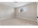 Bright, airy bedroom with a large window and neutral walls and modern carpet at 4842 Plata Del Sol Dr, Las Vegas, NV 89121