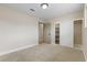 This neutral bedroom features carpet floors, closet with shelves, and natural light, perfect for relaxation at 4842 Plata Del Sol Dr, Las Vegas, NV 89121