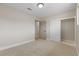 Neutral bedroom featuring carpet floors, closet with shelves, and natural light, perfect for relaxation at 4842 Plata Del Sol Dr, Las Vegas, NV 89121
