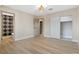 Bright bedroom with neutral walls, wood floors, closet and ensuite bath access at 4842 Plata Del Sol Dr, Las Vegas, NV 89121