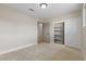 Neutral bedroom featuring carpet floors, closet with shelves, and natural light, perfect for relaxation at 4842 Plata Del Sol Dr, Las Vegas, NV 89121
