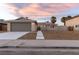 Charming single-story home with a two-car garage, desert landscaping, and freshly poured concrete walkway at 4842 Plata Del Sol Dr, Las Vegas, NV 89121