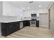 Spacious kitchen featuring stainless steel appliances, white subway tile backsplash, and modern two-tone cabinetry at 4842 Plata Del Sol Dr, Las Vegas, NV 89121
