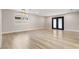 Bright and spacious living room with updated floors and new fixtures. Includes large sliding doors to the backyard at 4842 Plata Del Sol Dr, Las Vegas, NV 89121