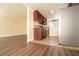 Kitchen with stainless steel appliances, wooden cabinetry, and views into the living area at 5000 Indian River Dr # 475, Las Vegas, NV 89103