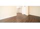 Bright, open living room with modern flooring, fresh paint, and access to other rooms at 5000 Indian River Dr # 475, Las Vegas, NV 89103