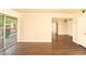 Bright, open living room with laminate floors and sliding glass door to balcony at 5000 Indian River Dr # 475, Las Vegas, NV 89103