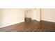 Spacious living room featuring laminate flooring, neutral walls, and bright lighting at 5000 Indian River Dr # 475, Las Vegas, NV 89103