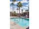 This is a full view of a condo complex pool with palm trees in the background at 5000 Indian River Dr # 475, Las Vegas, NV 89103