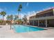 This is a full view of a pool with a condo complex in the background on a beautiful sunny day at 5000 Indian River Dr # 475, Las Vegas, NV 89103