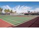 Community tennis court with lush palm trees, enhancing recreational opportunities for residents at 5000 Indian River Dr # 475, Las Vegas, NV 89103