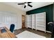 Bedroom featuring a ceiling fan and a built-in bookcase at 5588 Holcomb Bridge Ct, Las Vegas, NV 89149