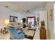 Bright living room featuring tile floors, a ceiling fan, and comfortable seating at 563 Cypress Gardens Pl, Henderson, NV 89012