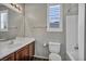 Well-lit bathroom with wood vanity, and shower-tub combination at 576 Bayo Canyon Ct, Henderson, NV 89015